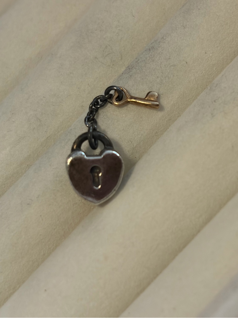 retired,authentic two-tone Pandora charm known as Key to My Heart Padlock Charm